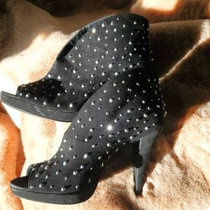 Pair of sparkly INC boots size 6.